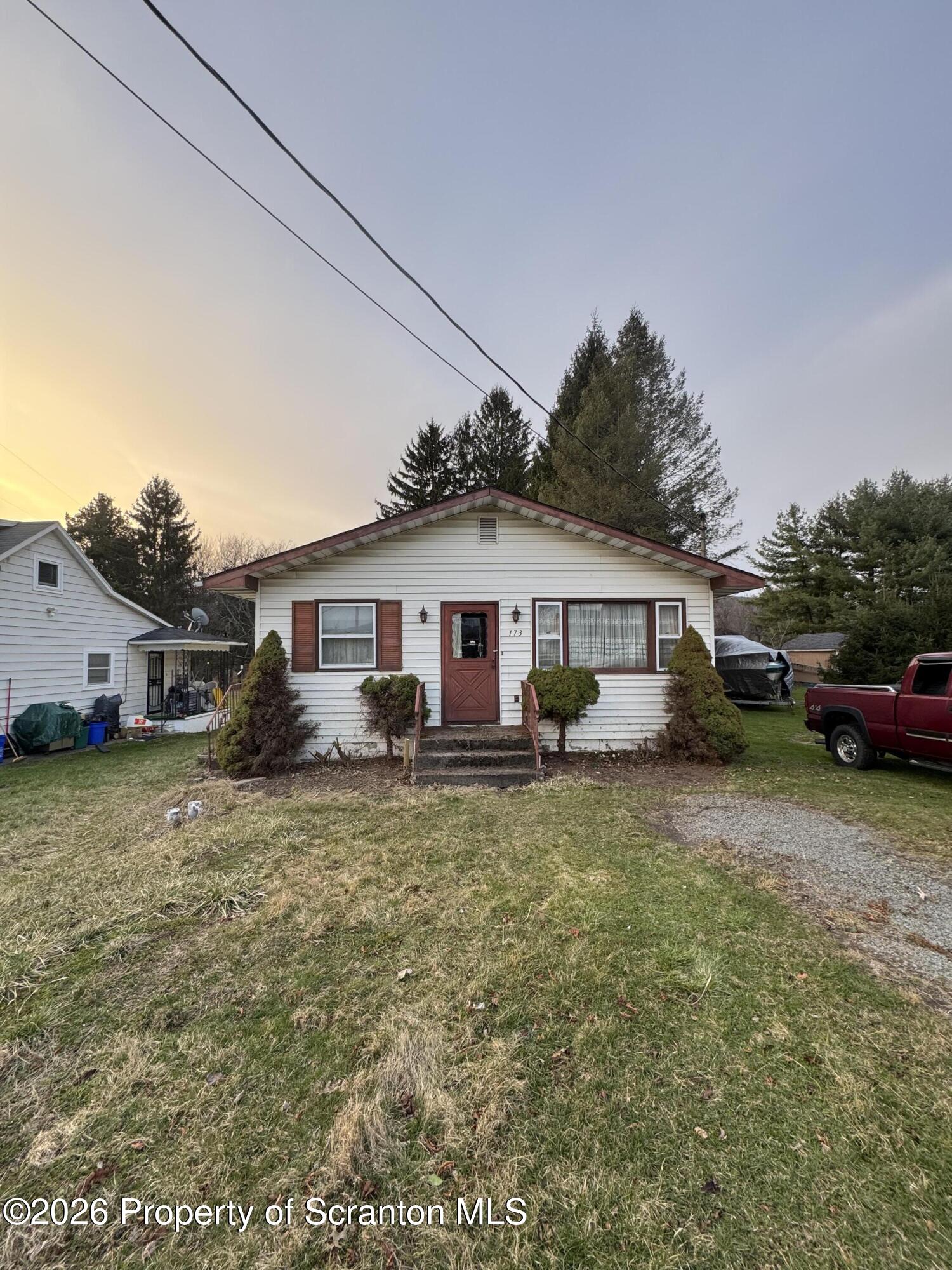 a view of a house with a yard
