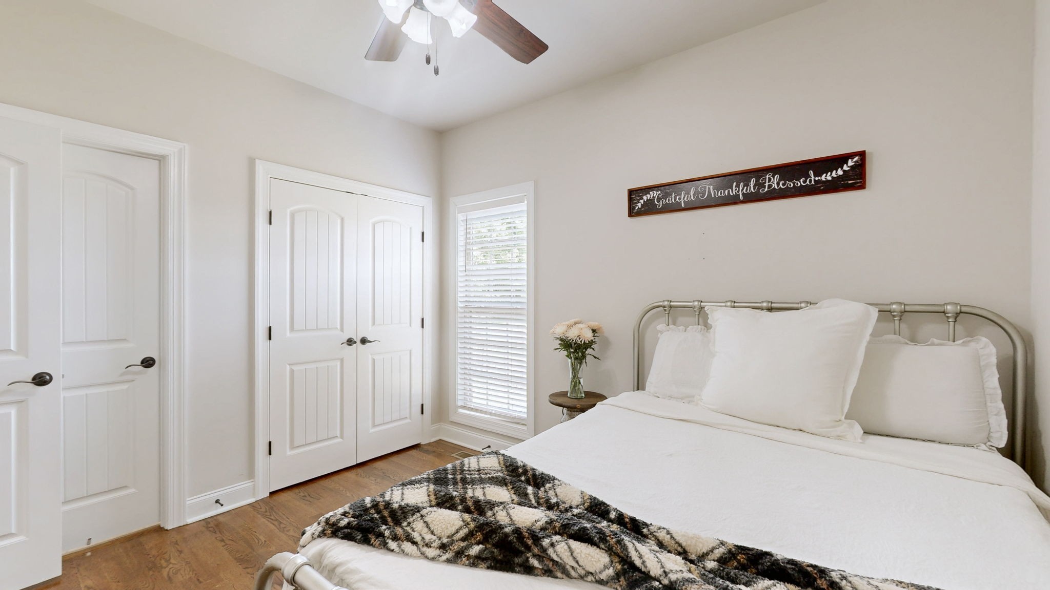 15505 Versailles Road Rockvale, TN 37153 - Photo 18 of 38 a bedroom with a bed and a chandelier