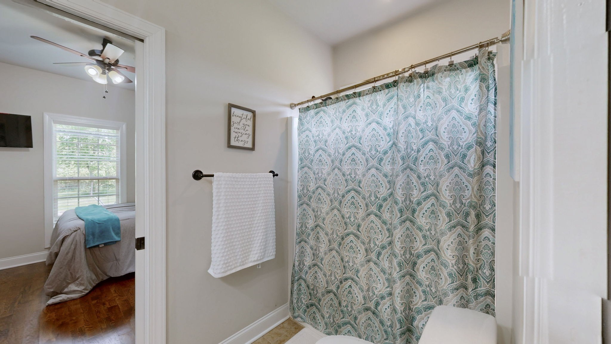 15505 Versailles Road Rockvale, TN 37153 - Photo 27 of 38 a bathroom with a shower curtain and a sink