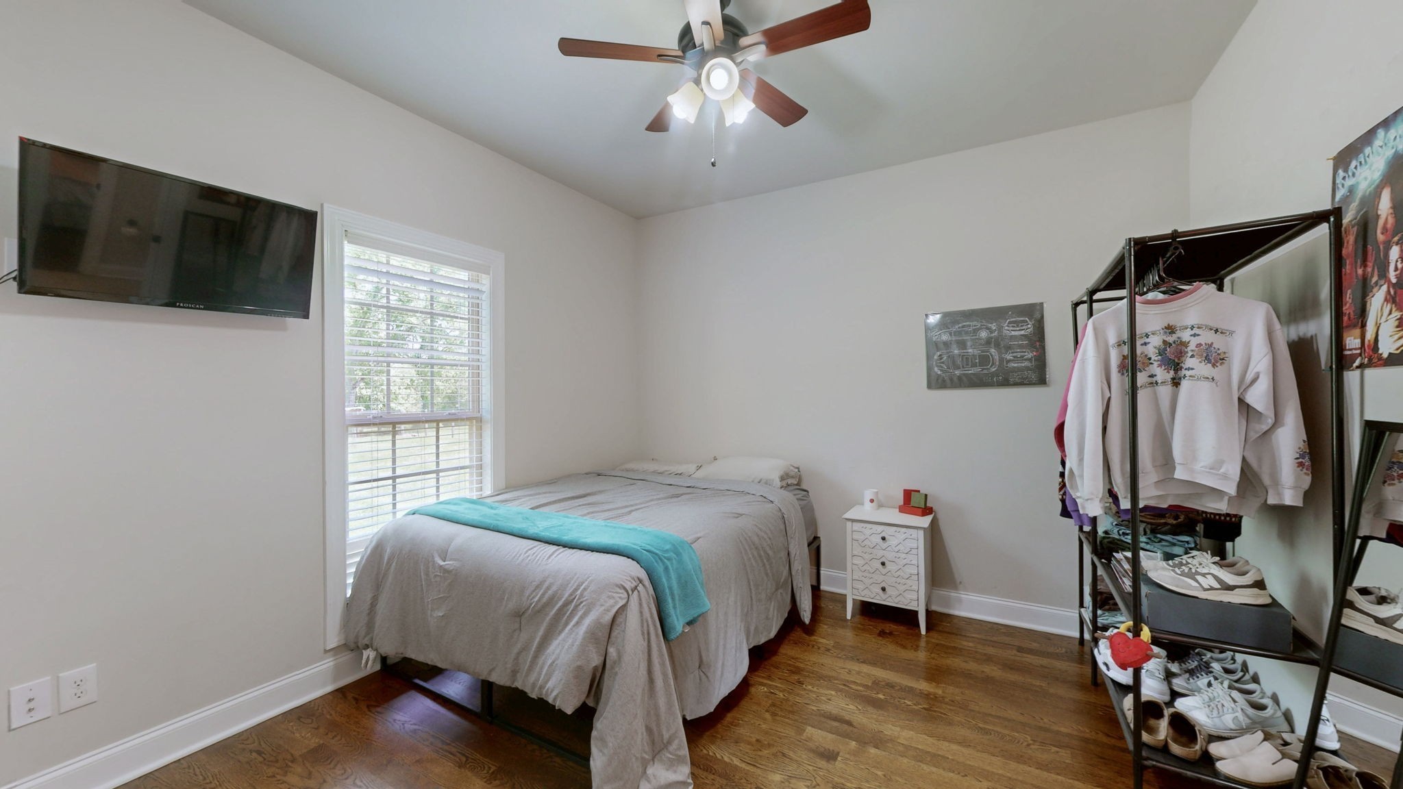 15505 Versailles Road Rockvale, TN 37153 - Photo 28 of 38 a bedroom with a bed a flat screen tv and a window