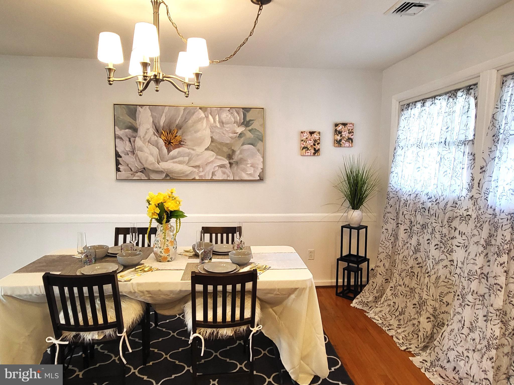 3408 Ridgeway Road Harrisburg, PA 17109 - Photo 14 of 40 a view of a dining room with furniture wooden floor and a chandelier