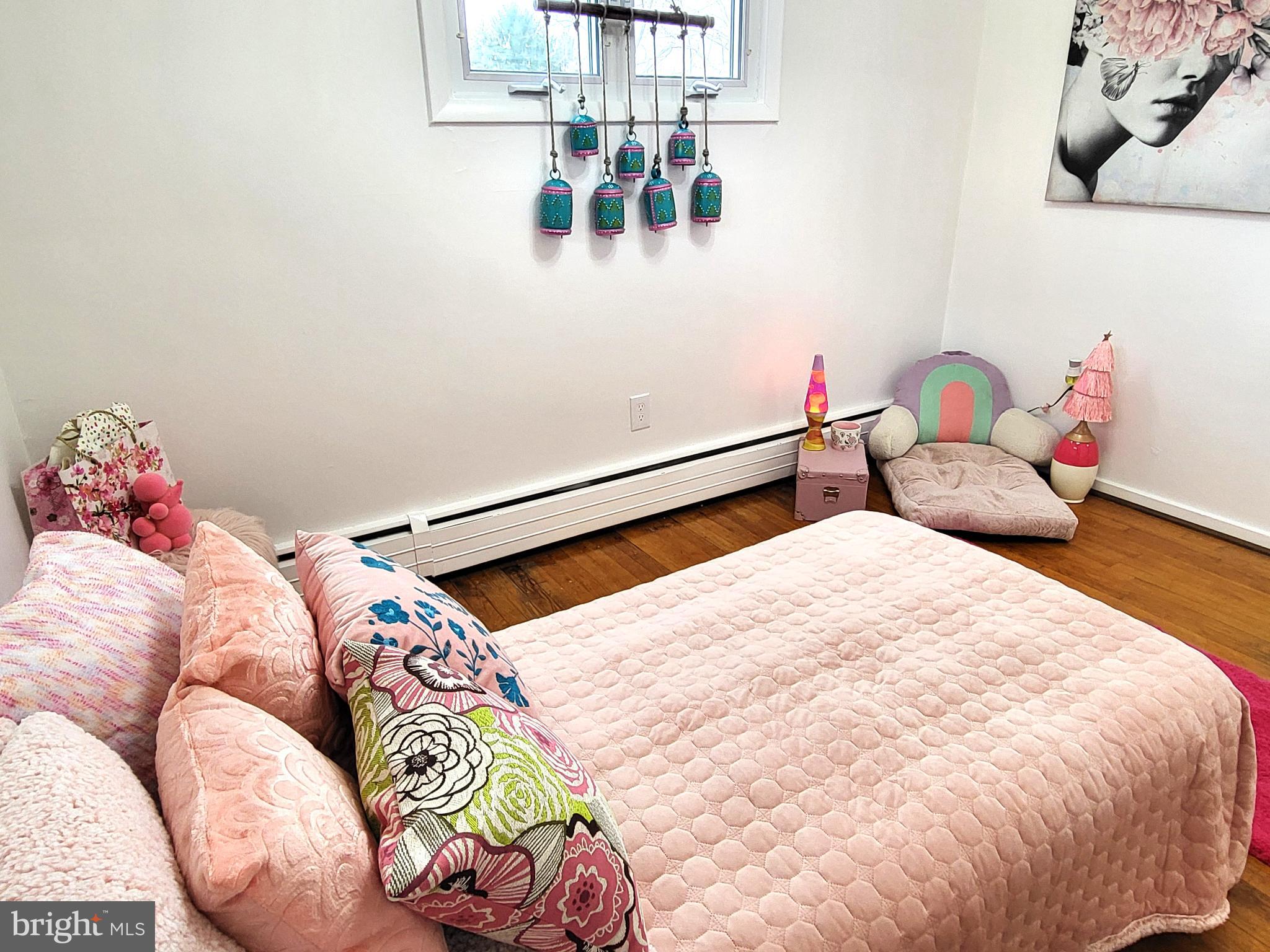 3408 Ridgeway Road Harrisburg, PA 17109 - Photo 23 of 40 a bedroom with a bed and a chandelier