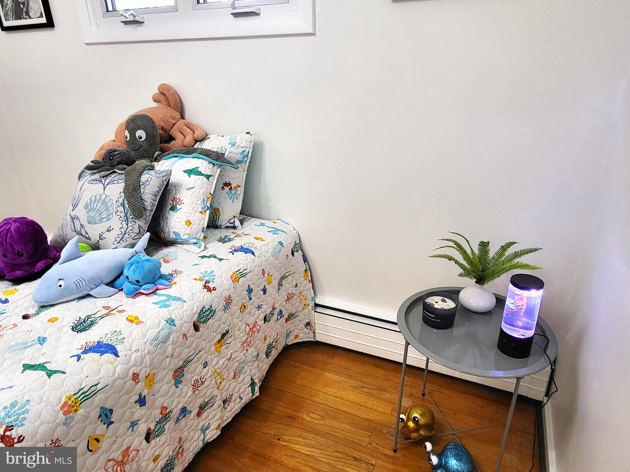 3408 Ridgeway Road Harrisburg, PA 17109 - Photo 25 of 40 a bedroom with a bed and a potted plant
