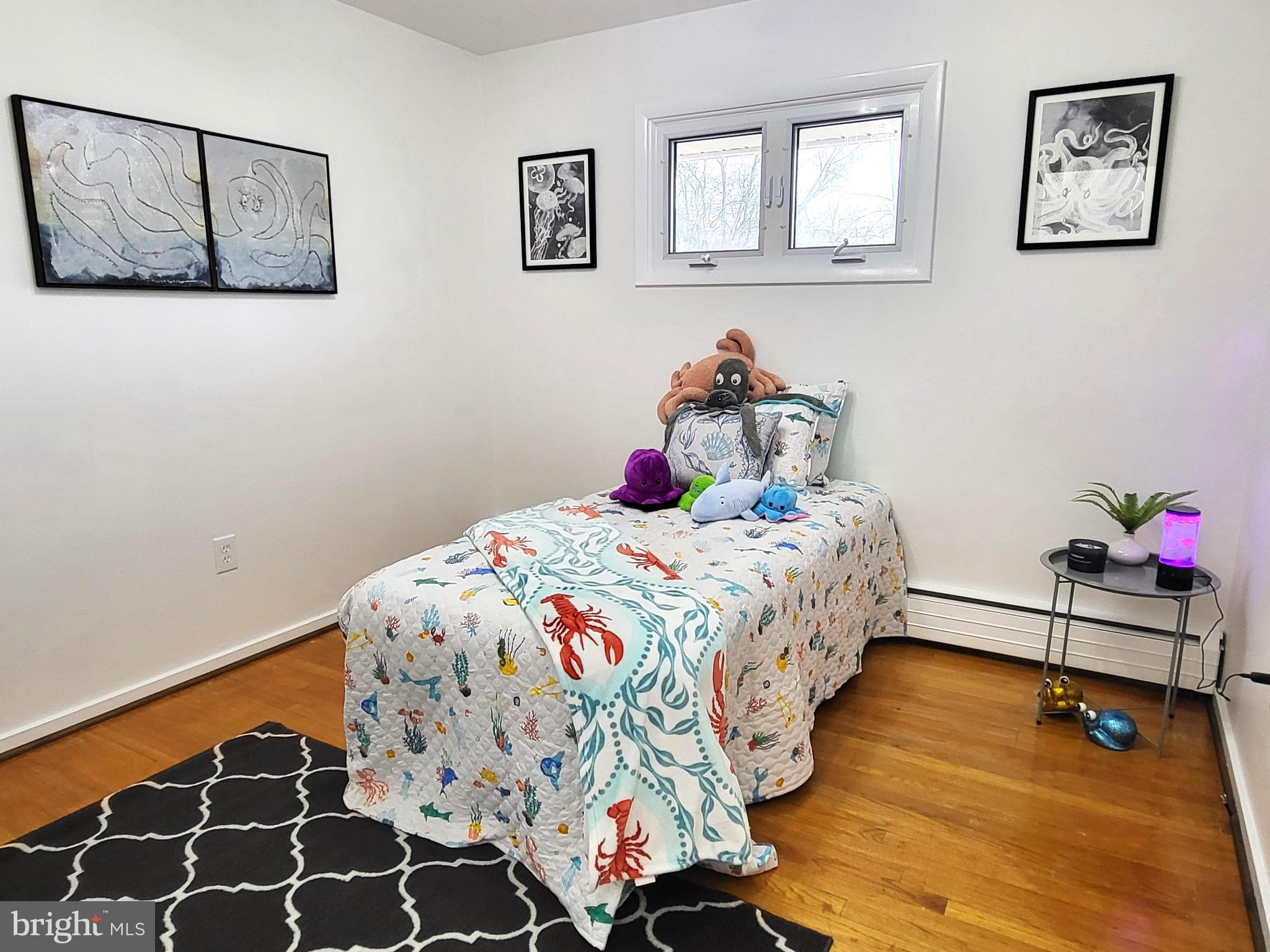 3408 Ridgeway Road Harrisburg, PA 17109 - Photo 26 of 40 a bedroom with a bed and wooden floor