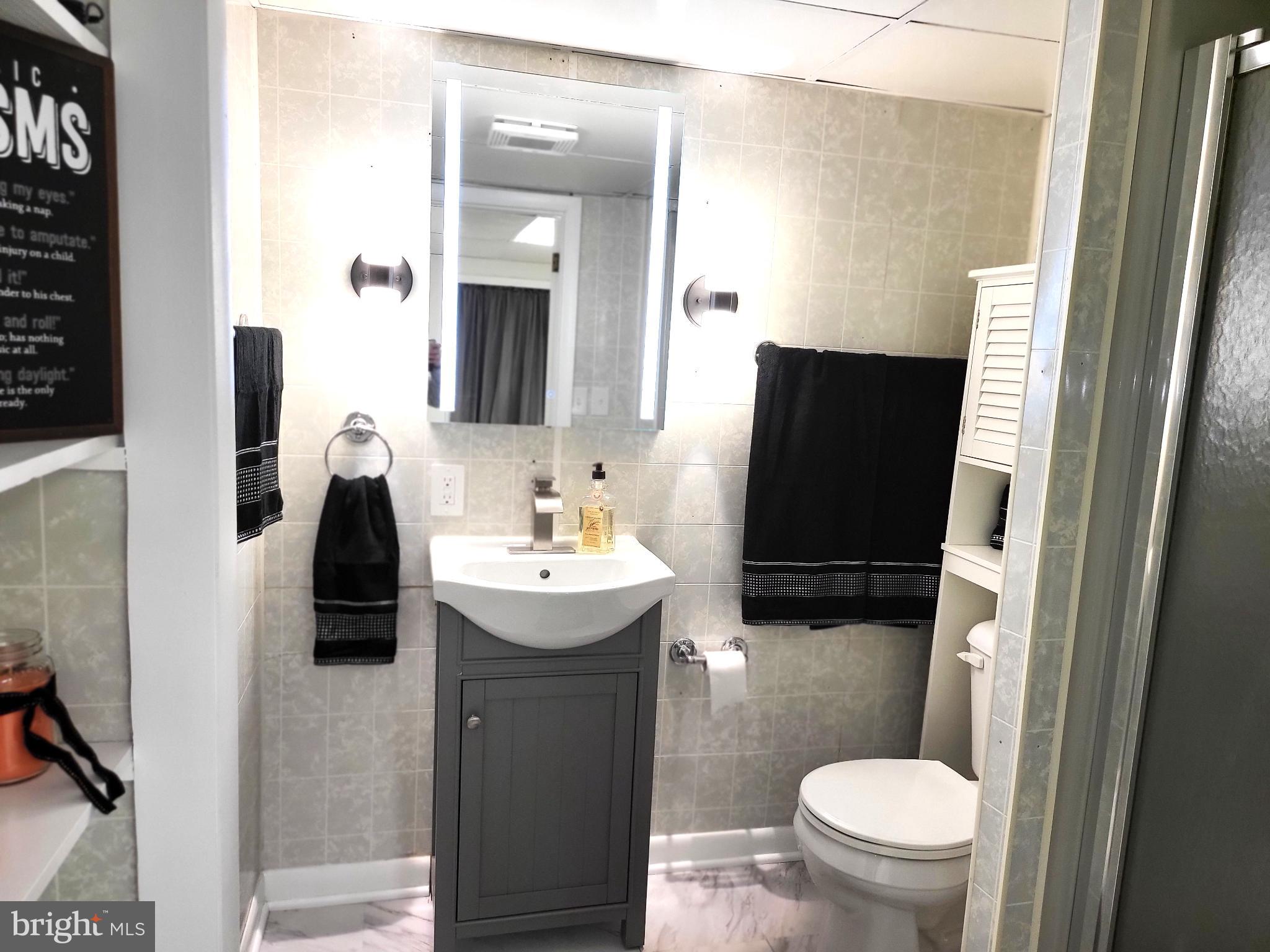 3408 Ridgeway Road Harrisburg, PA 17109 - Photo 35 of 40 a bathroom with a sink toilet and mirror