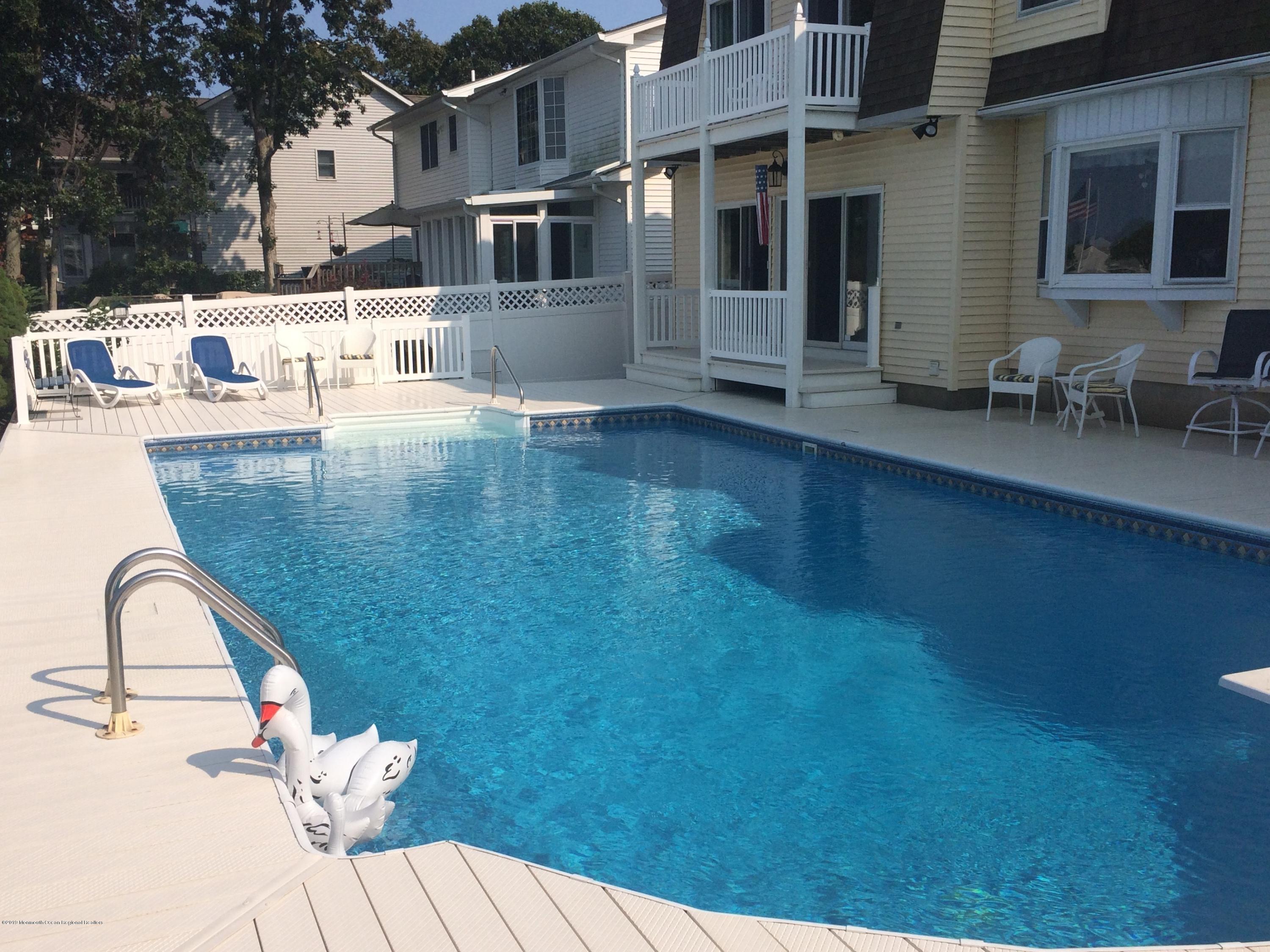566 Harbor Road Brick, NJ 08724 - Photo 16 of 100 a view of a patio with table and chairs and potted plants