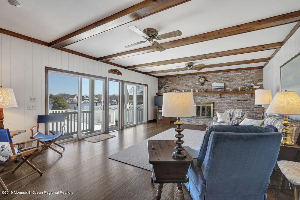 566 Harbor Road Brick, NJ 08724 - Photo 20 of 100 a living room with fireplace furniture and a large window