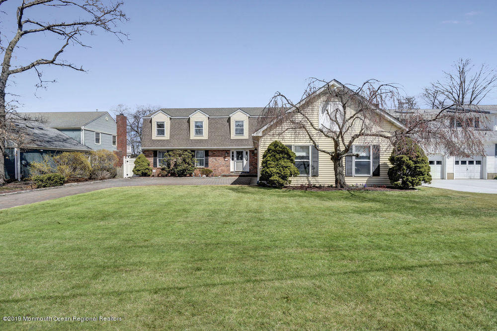 566 Harbor Road Brick, NJ 08724 - Photo 4 of 100 a front view of a house with a yard