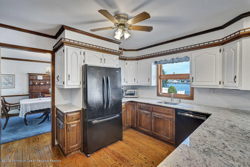 566 Harbor Road Brick, NJ 08724 - Photo 31 of 100 a kitchen with stainless steel appliances granite countertop a sink a stove and a refrigerator