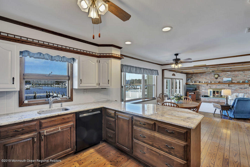 566 Harbor Road Brick, NJ 08724 - Photo 32 of 100 a kitchen with stainless steel appliances granite countertop a sink and cabinets