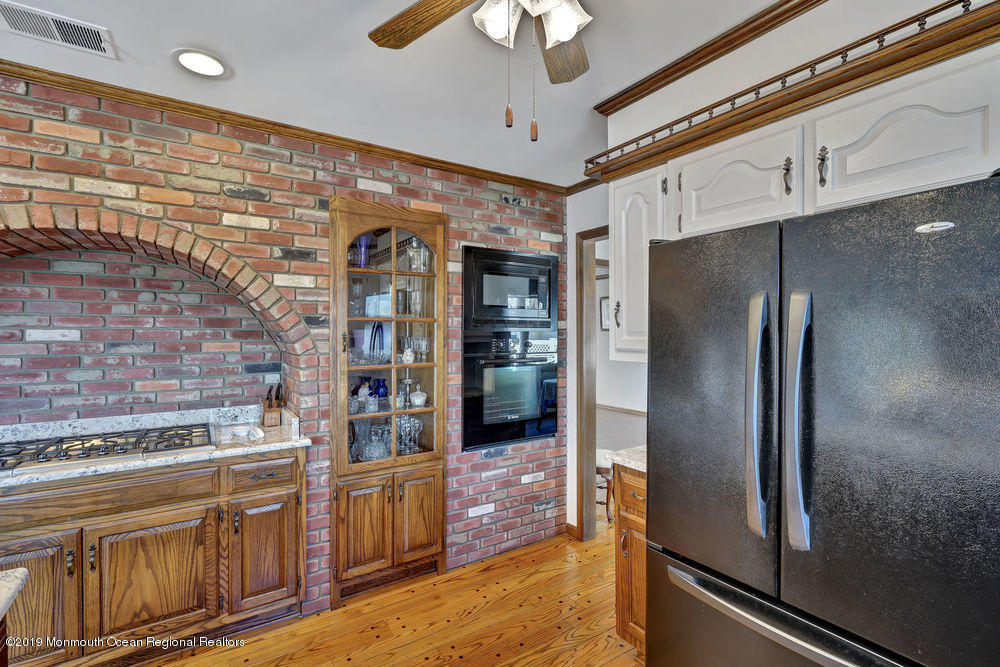 566 Harbor Road Brick, NJ 08724 - Photo 34 of 100 a kitchen with stainless steel appliances granite countertop a refrigerator and a stove