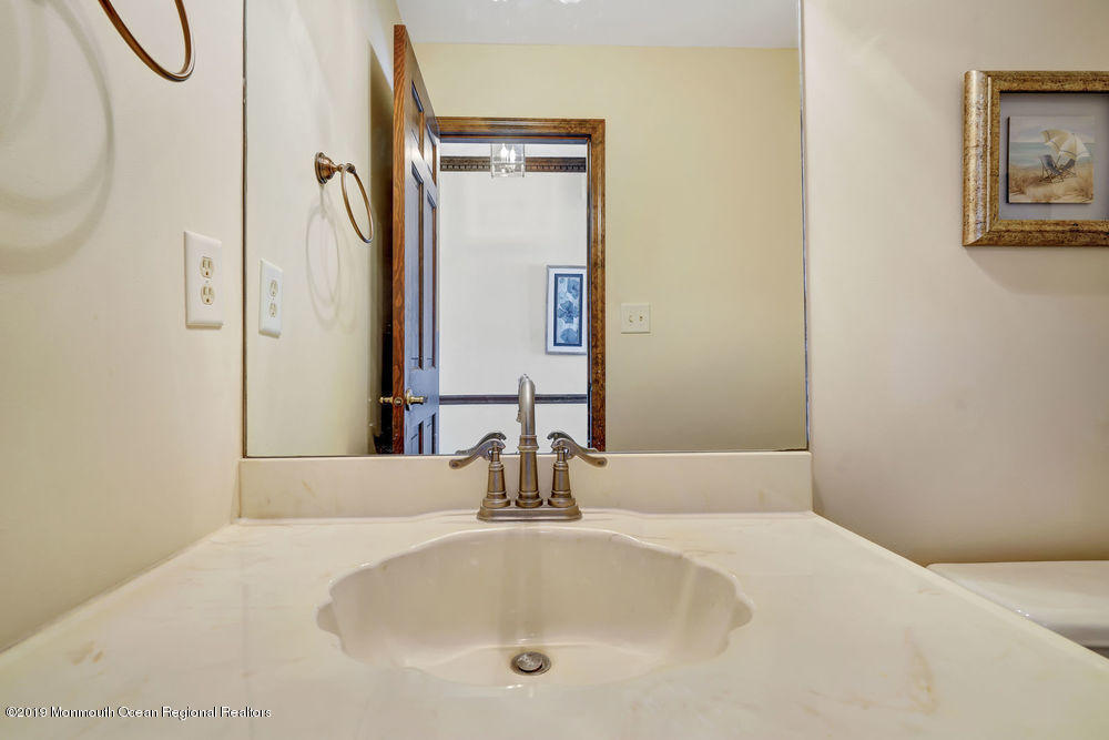 566 Harbor Road Brick, NJ 08724 - Photo 44 of 100 a bathroom with a tub sink and mirror