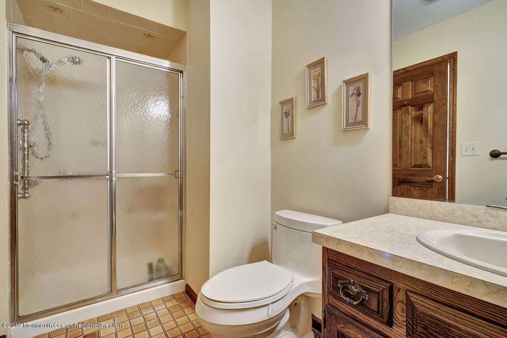 566 Harbor Road Brick, NJ 08724 - Photo 50 of 100 a bathroom with a granite countertop sink toilet and shower