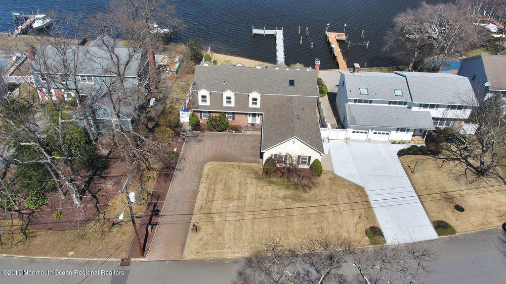 566 Harbor Road Brick, NJ 08724 - Photo 6 of 100 a picture of a building with a yard