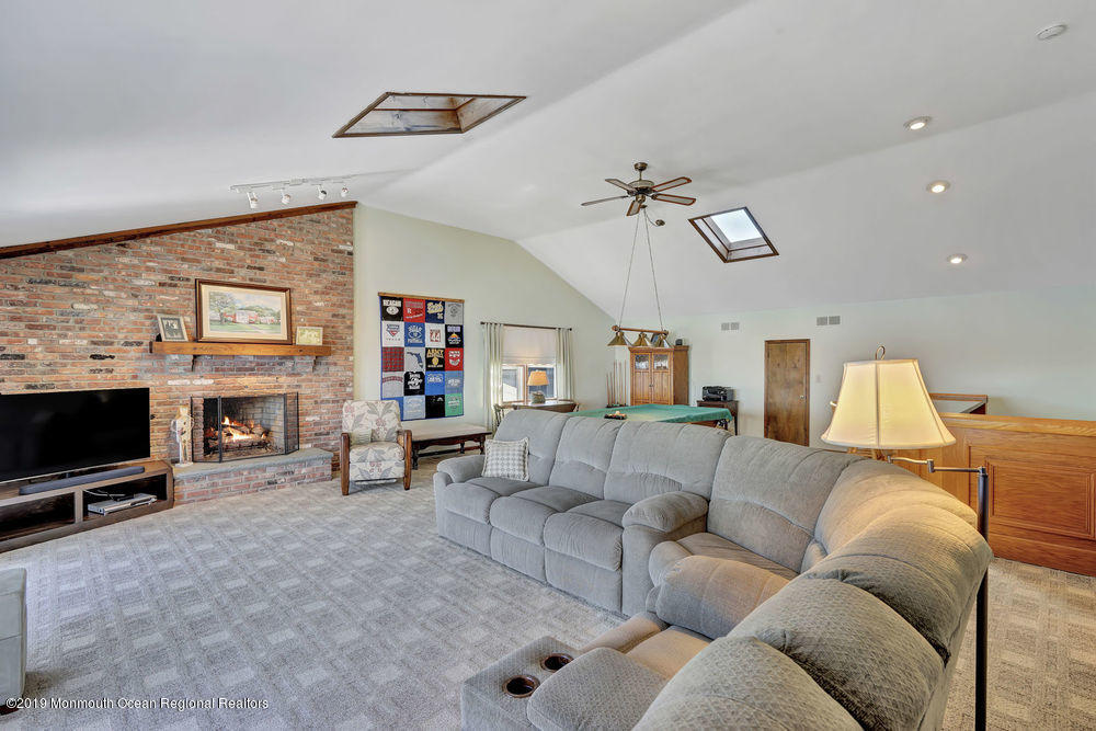 566 Harbor Road Brick, NJ 08724 - Photo 58 of 100 a living room with furniture and a flat screen tv