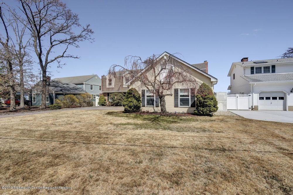 566 Harbor Road Brick, NJ 08724 - Photo 100 of 100 a front view of a house with a yard and garage