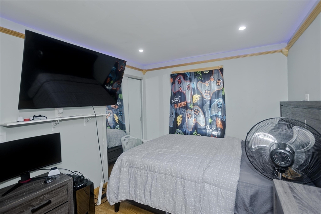 10 View Street Holyoke, MA 01040 - Photo 20 of 38 a bedroom with a bed and a television