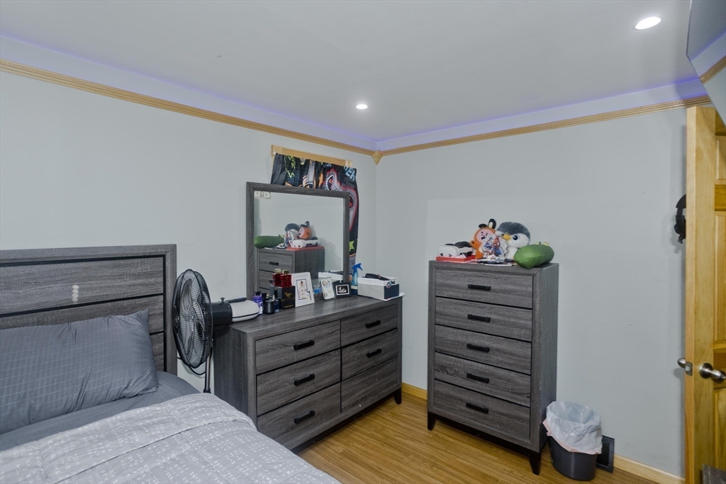 10 View Street Holyoke, MA 01040 - Photo 21 of 38 a room with furniture and wooden floor