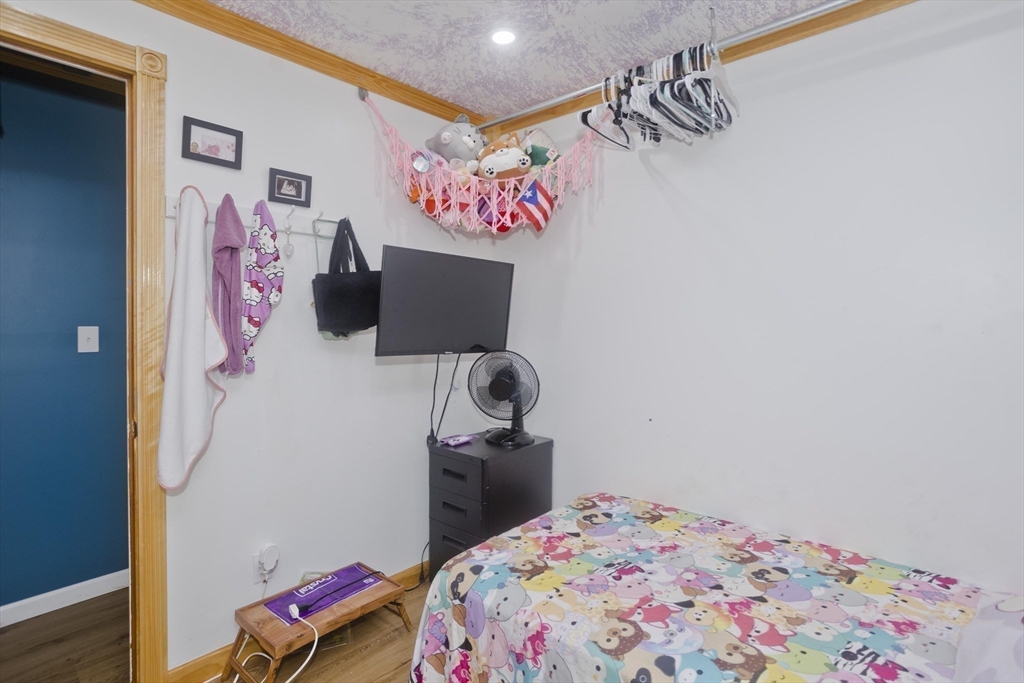 10 View Street Holyoke, MA 01040 - Photo 23 of 38 a bedroom with a bed and cabinets