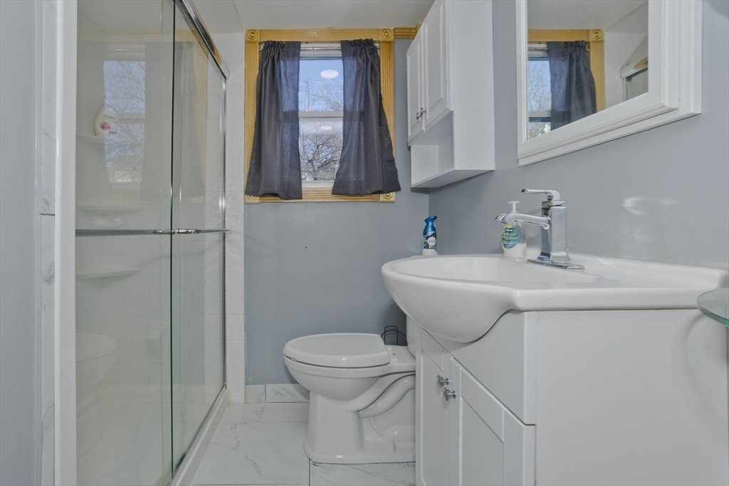 10 View Street Holyoke, MA 01040 - Photo 24 of 38 a bathroom with a toilet sink and mirror