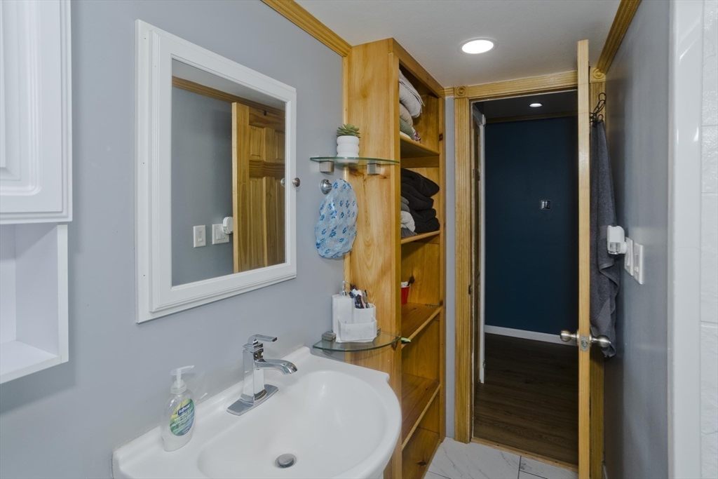 10 View Street Holyoke, MA 01040 - Photo 25 of 38 a bathroom with a sink and a mirror