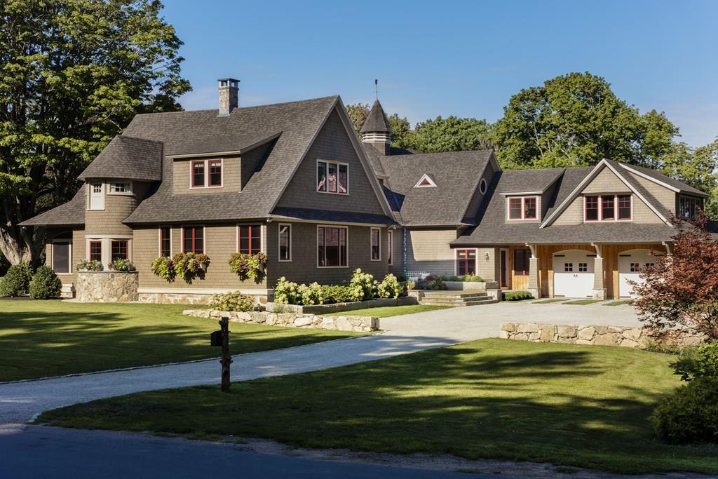a front view of a house with a yard table and chairs