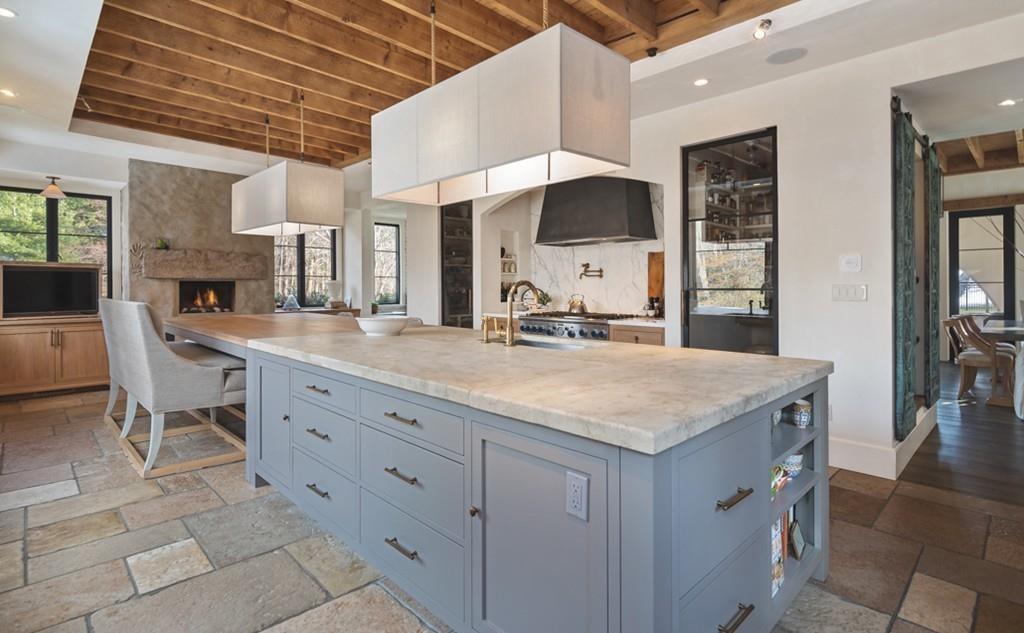 34 Martins Lane Hingham, MA 02043 - Photo 11 of 42 a hall with kitchen island granite countertop a sink and a cabinets
