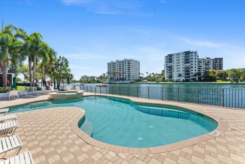 a view of a swimming pool with a yard