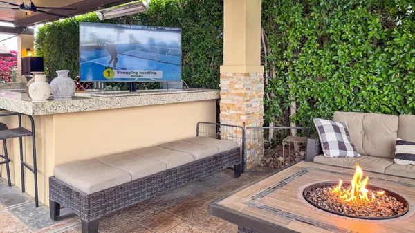 a outdoor living space with furniture and a potted plant