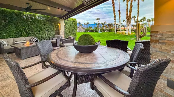 a view of a patio in the backyard