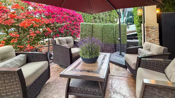 a outdoor living space with furniture potted plant and outdoor view