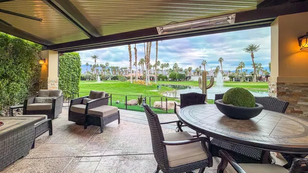 a view of a patio with couches chairs dining table and chairs