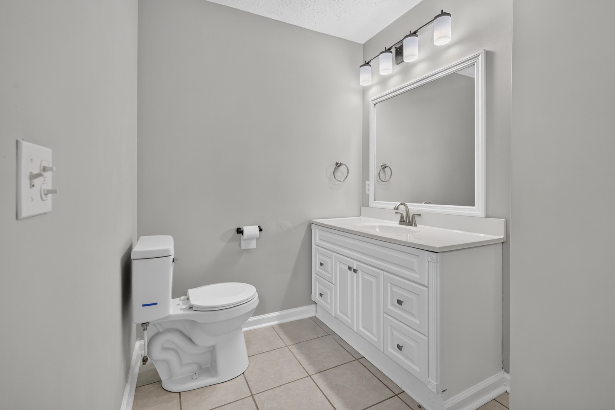 120 Driver Road Lafayette, TN 37083 - Photo 19 of 39 a bathroom with a double vanity sink and a toilet