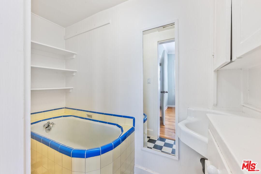 137 Strand Street Santa Monica, CA 90405 - Photo 7 of 11 a bathroom with a tub and shower