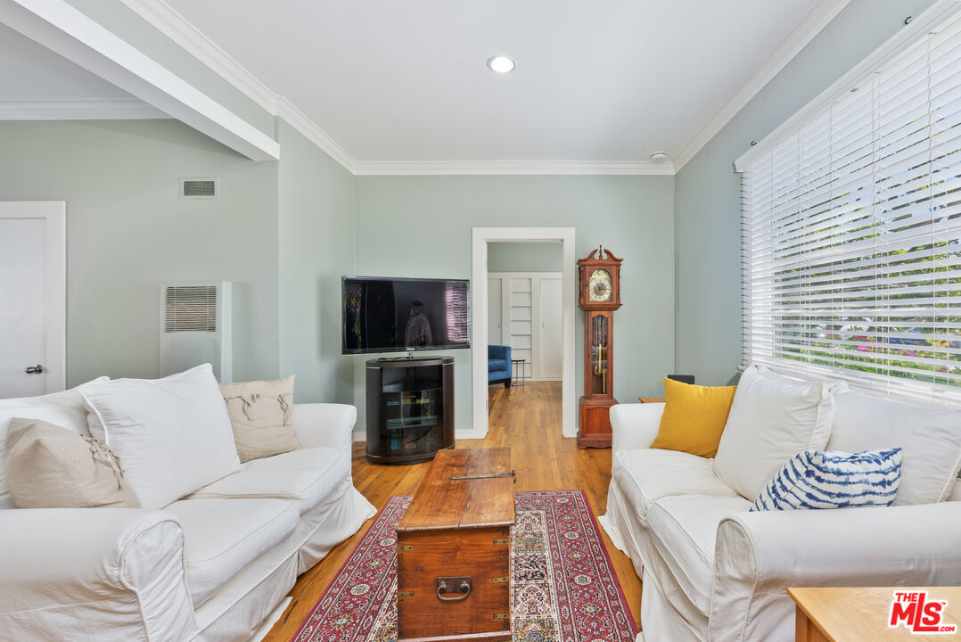 137 Strand Street Santa Monica, CA 90405 - Photo 10 of 11 a living room with furniture and a flat screen tv