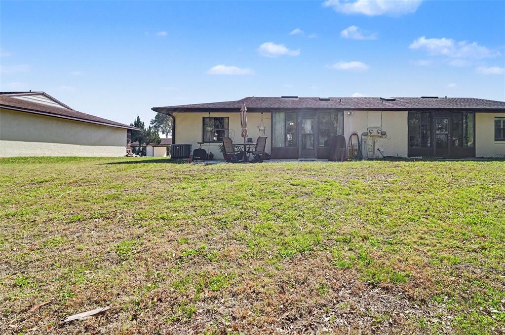 12435 Orangewood Circle Tavares, FL 32778 - Photo 28 of 30 a view of a house with a yard