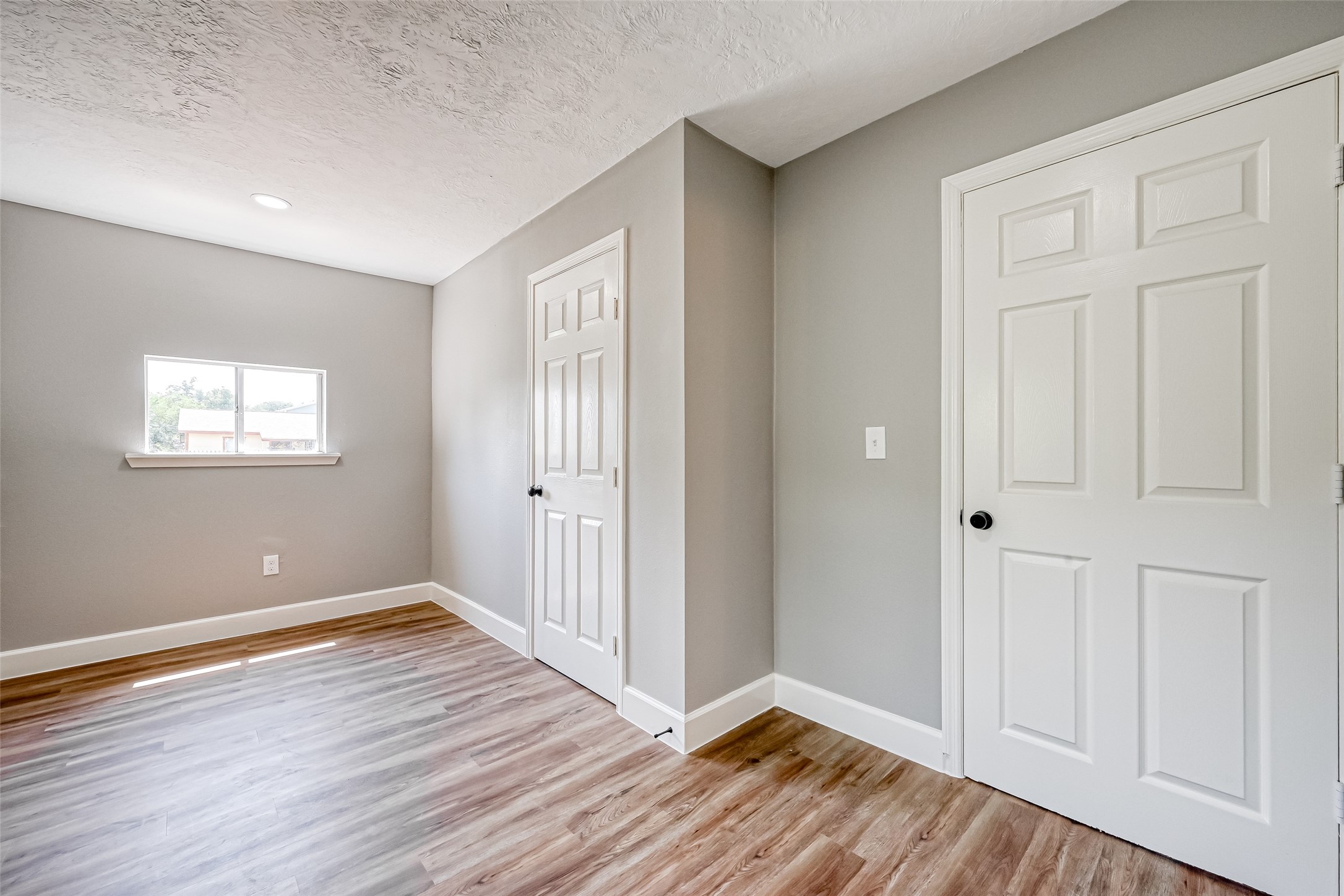 6715 Victoria Street Houston, TX 77020 - Photo 31 of 46 a view of an empty room with wooden floor