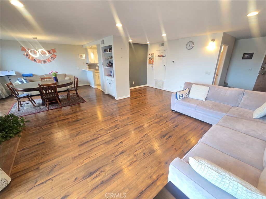 8828 Pershing Drive, Unit 121 Playa del Rey, CA 90293 - Photo 11 of 54 a living room with furniture and a wooden floor