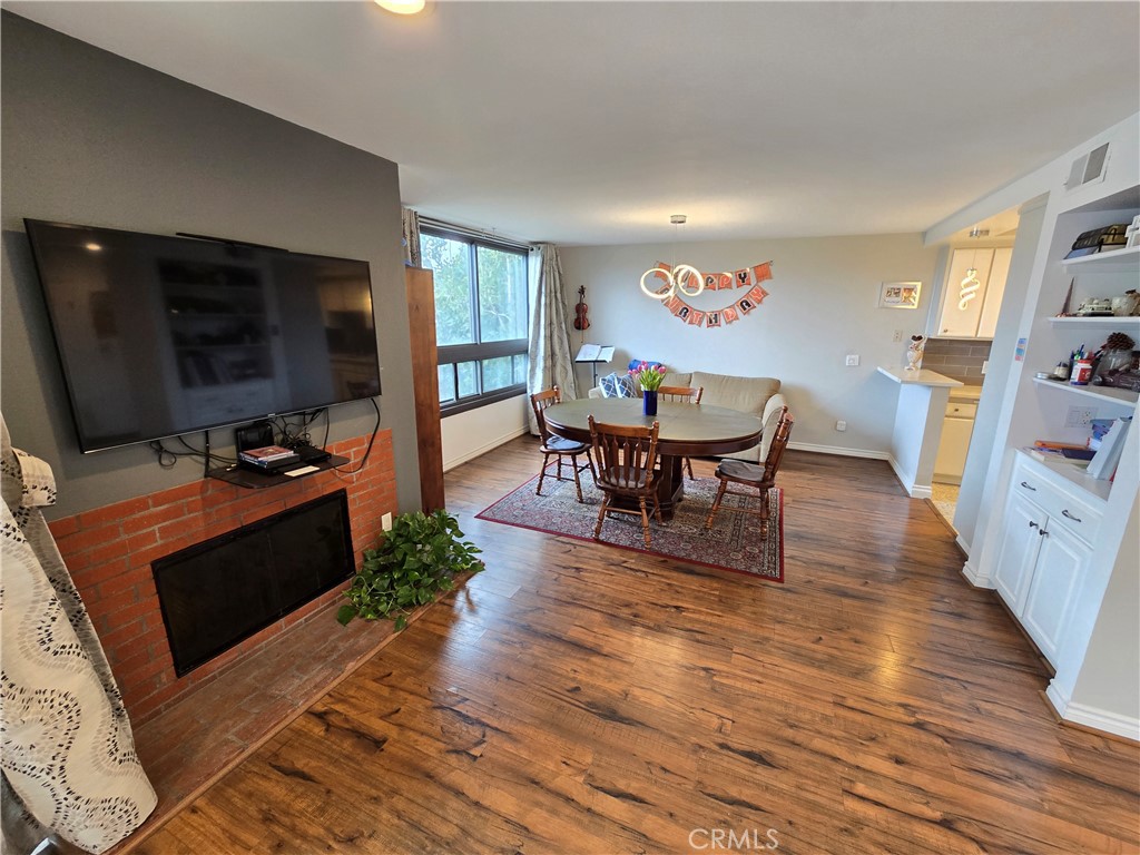 8828 Pershing Drive, Unit 121 Playa del Rey, CA 90293 - Photo 12 of 54 a living room with furniture and a flat screen tv