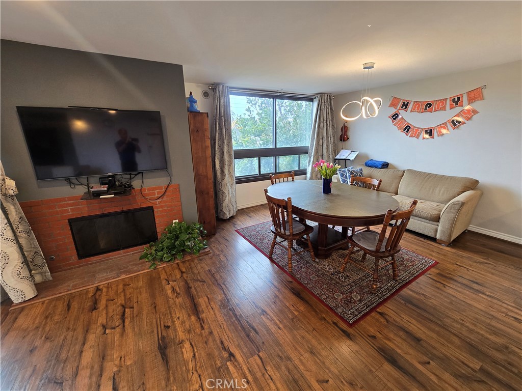 8828 Pershing Drive, Unit 121 Playa del Rey, CA 90293 - Photo 14 of 54 a living room with furniture a flat screen tv and a large window