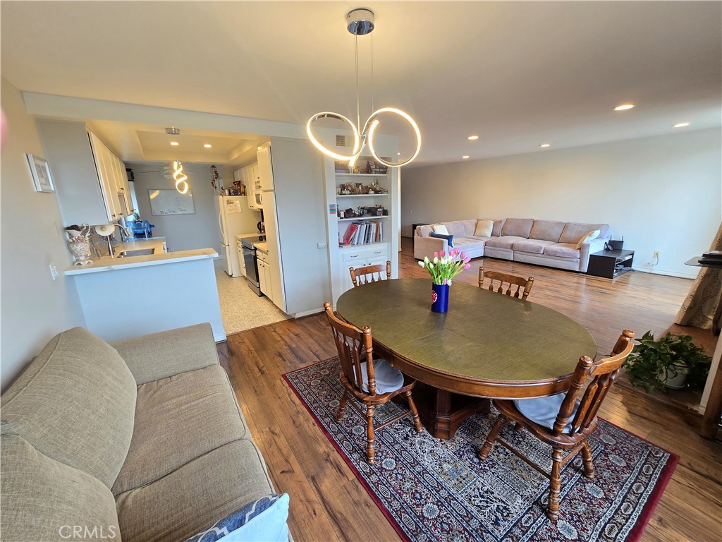 8828 Pershing Drive, Unit 121 Playa del Rey, CA 90293 - Photo 15 of 54 a living room with furniture and a wooden floor