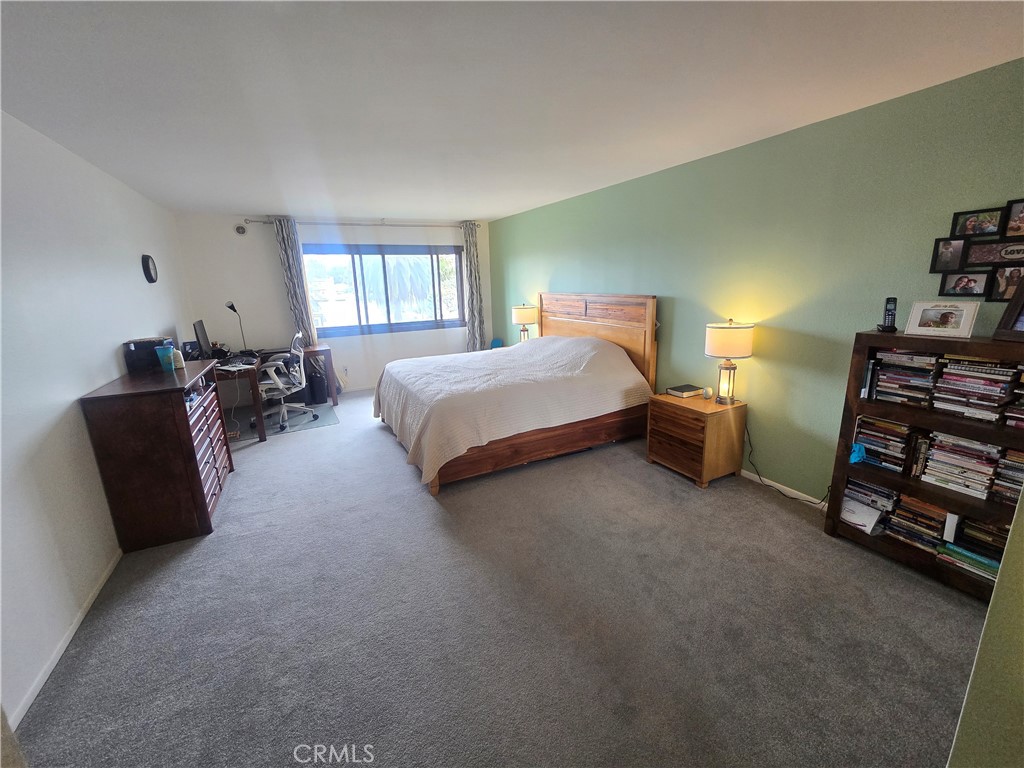 8828 Pershing Drive, Unit 121 Playa del Rey, CA 90293 - Photo 18 of 54 a spacious bedroom with a bed and a couch