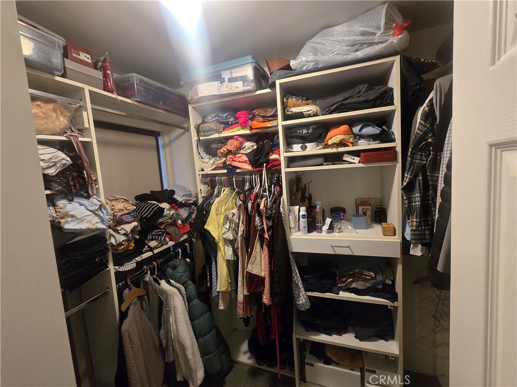 8828 Pershing Drive, Unit 121 Playa del Rey, CA 90293 - Photo 19 of 54 a view of walk in closet with clothes and shoes