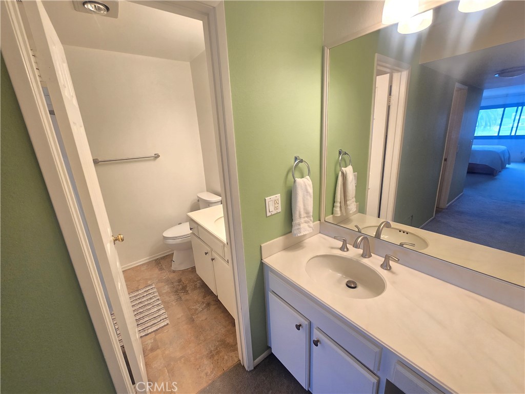 8828 Pershing Drive, Unit 121 Playa del Rey, CA 90293 - Photo 20 of 54 a bathroom with a sink a toilet a shower and a mirror