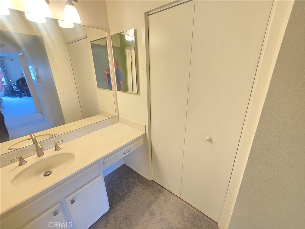 8828 Pershing Drive, Unit 121 Playa del Rey, CA 90293 - Photo 24 of 54 a bathroom with a sink and a mirror