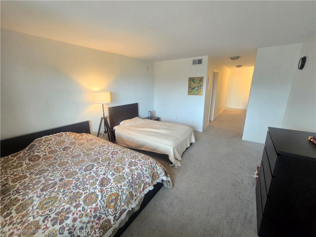 8828 Pershing Drive, Unit 121 Playa del Rey, CA 90293 - Photo 25 of 54 a bedroom with two beds and a dresser