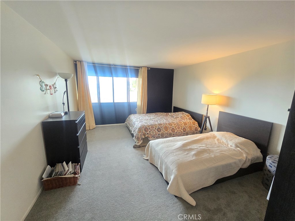 8828 Pershing Drive, Unit 121 Playa del Rey, CA 90293 - Photo 26 of 54 a bedroom with two beds and a window