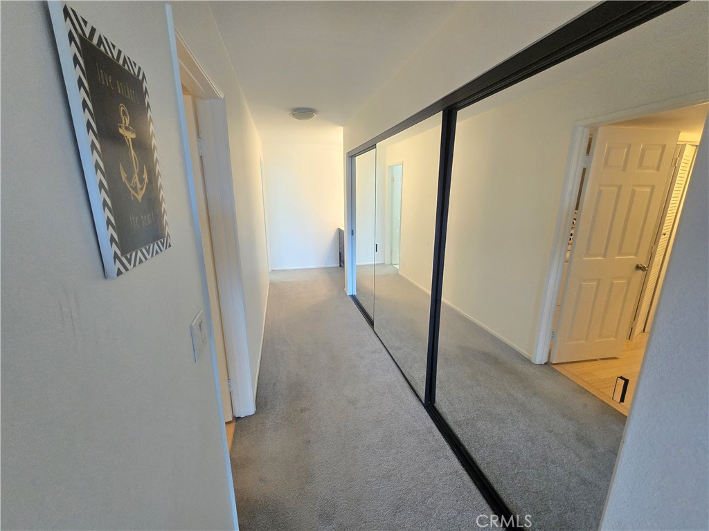 8828 Pershing Drive, Unit 121 Playa del Rey, CA 90293 - Photo 30 of 54 a view of a hallway with a glass door