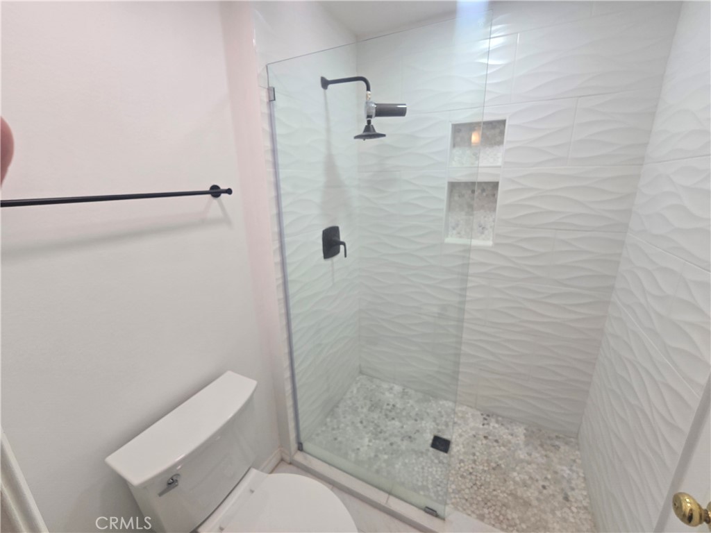 8828 Pershing Drive, Unit 121 Playa del Rey, CA 90293 - Photo 32 of 54 a bathroom with a shower and toilet