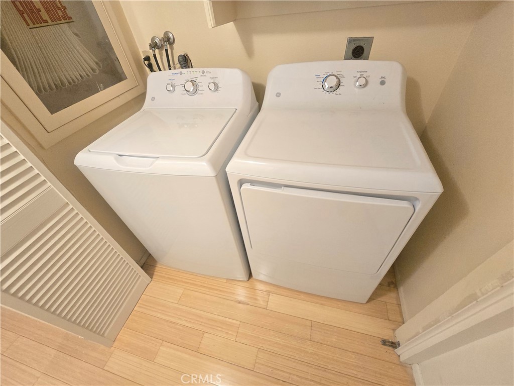 8828 Pershing Drive, Unit 121 Playa del Rey, CA 90293 - Photo 34 of 54 a utility room with dryer and washer
